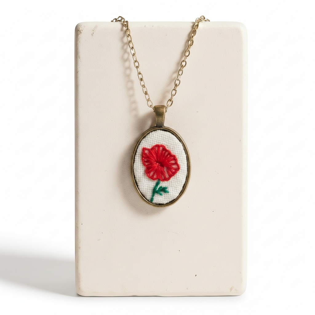 Necklace with a red flower pendant on a white background