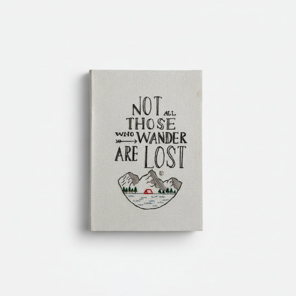 Canvas wall art with 'Not all those who wander are lost' quote and mountain illustration on a white background