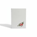 White pocket diary with floral design on a white background