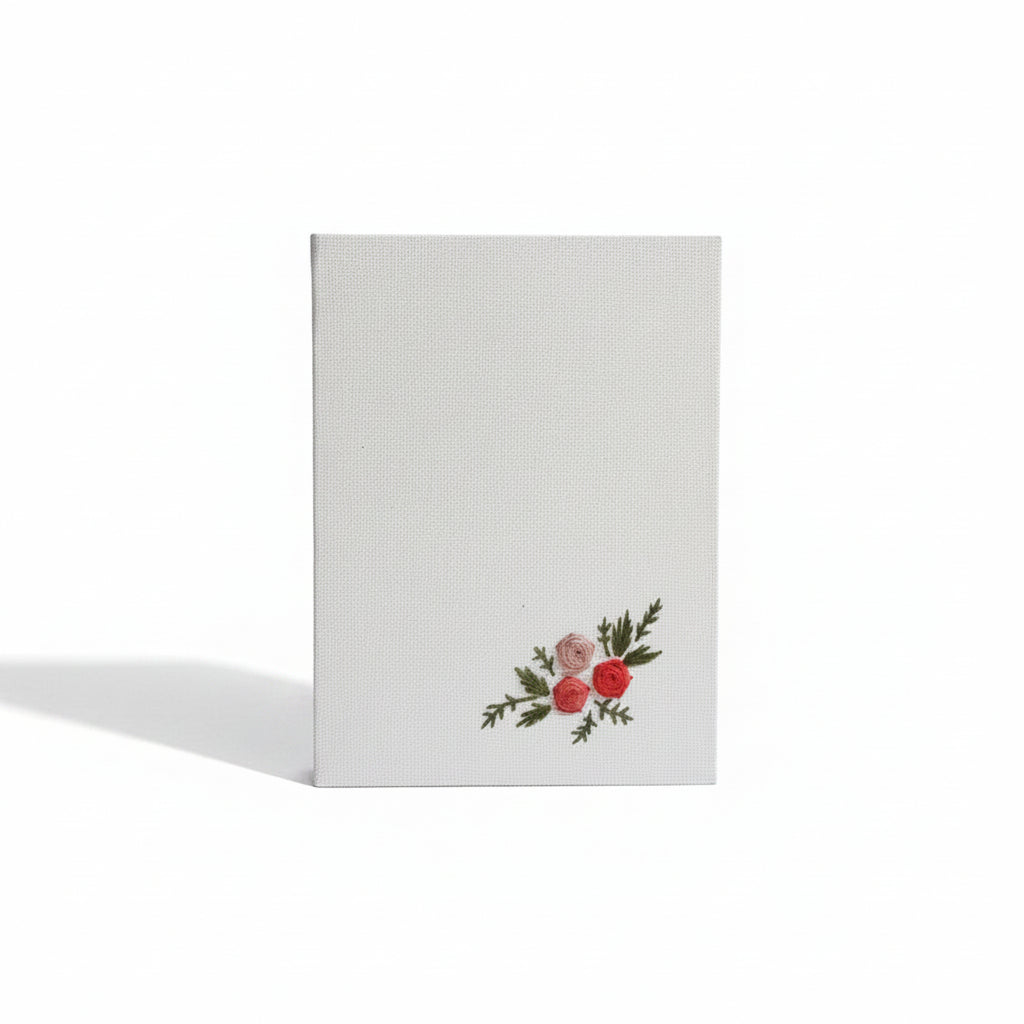 White pocket diary with floral design on a white background